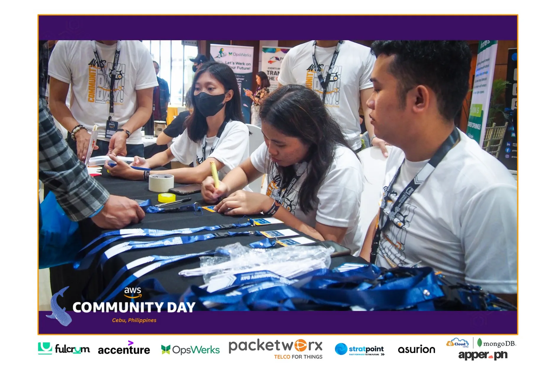 Participants engaging at a tech booth